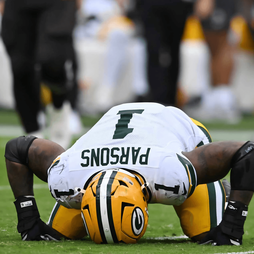 Micah Parsons on the field in a Green Bay Packers uniform