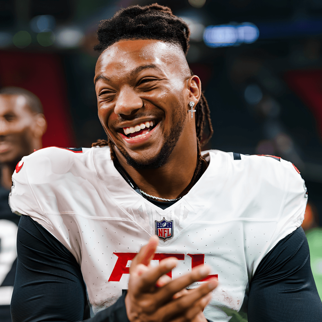 Bijan Robinson celebrating in an Atlanta Falcons uniform