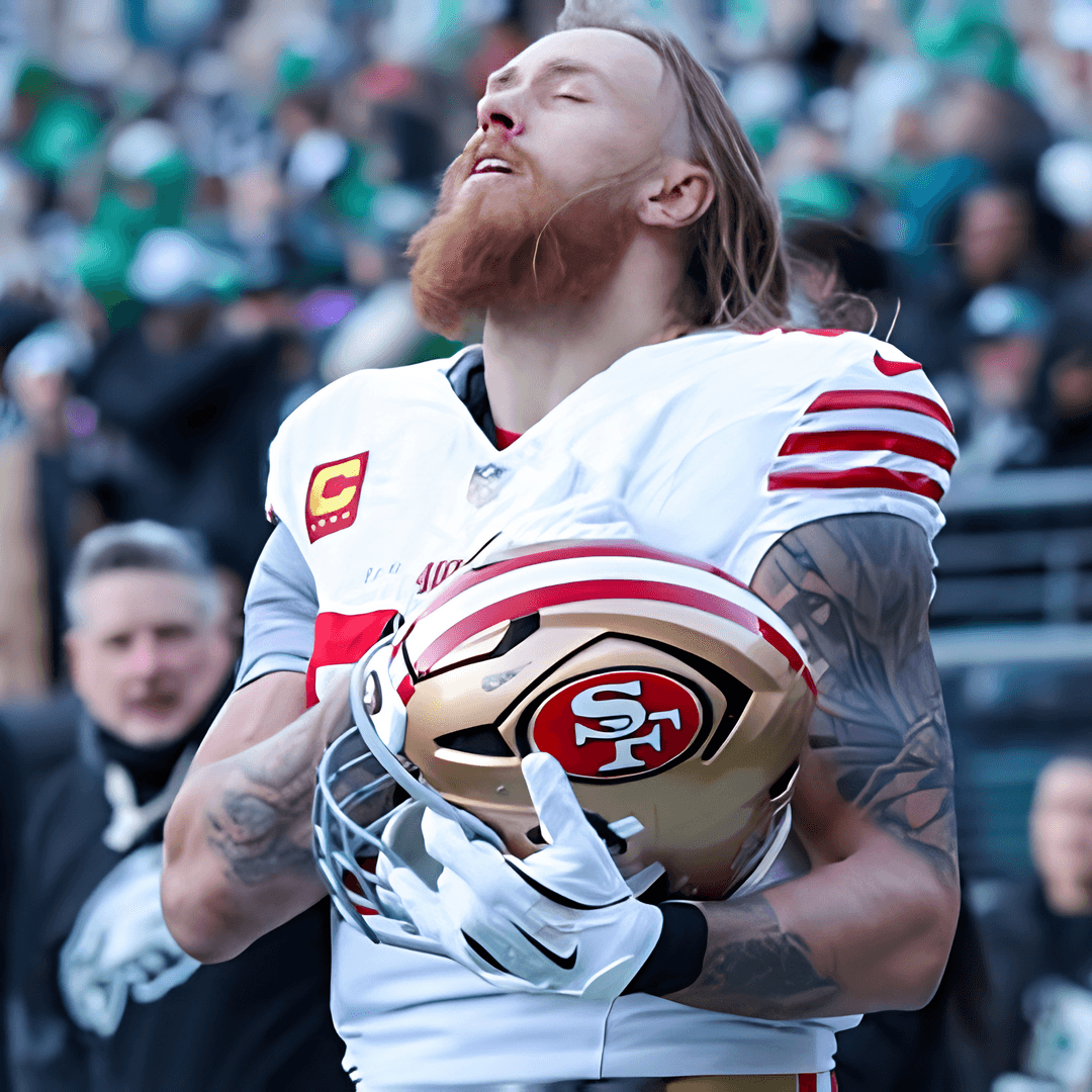George Kittle holding his San Francisco helmet